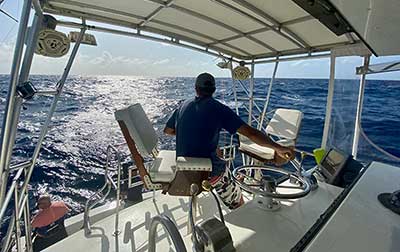 The Captain of Flying Fish Charters handling the waves.