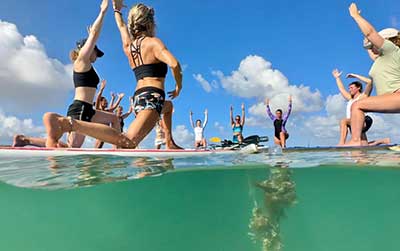 Challenge yourself wit a fun SUP Yoga class