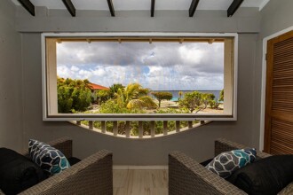 The porch and lounge area in a two-bedroom condo at Sand Dollar.